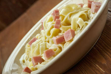 Fettuccine Alfredo - type of pasta popular in Roman and Tuscan cuisine.の写真素材