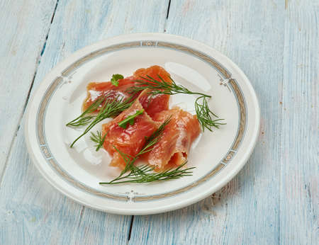 Graavilohi -  Nordic dish consisting of raw salmon, cured in salt, sugar, and dill.の写真素材