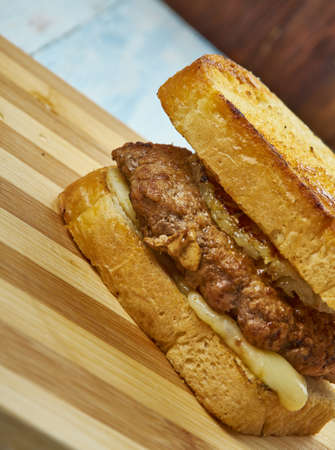 Cowboytoast, Finnish sandwich, consists of two pieces of toast, butter , chop and onion.の写真素材