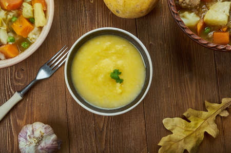 Cheddar Ale Soup, version of fondue., Irish cuisine, Traditional assorted dishes, Top view.