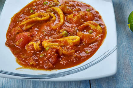 Koonthal Kulambu, Squid in Roasted coconut gravy is cooked , Kerala Style cuisine, Traditional...