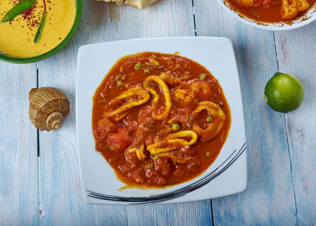 Koonthal Kulambu, Squid in Roasted coconut gravy is cooked , Kerala Style cuisine, Traditional...