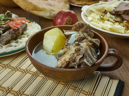 Shorpo ,  aromatic meat broth,  Kyrgyz  cuisine, Traditional assorted dishes, Top view.