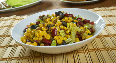 Vegan salad with corn, beans and pickled cucumberの写真素材