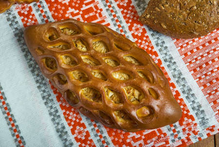 Pirog, Russian traditional pies piroshki , assorted pastry: dishes, Top view.Savoury versions may consist of meat, fish, mushrooms, cabbage, rice, buckwheat groats or potato.の写真素材