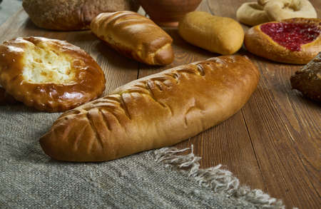 Coulibiac, Russian traditional pies piroshki , assorted pastry: dishes, Top view.with salmon or...