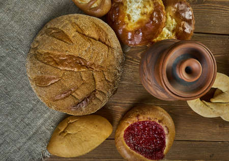 Rustic rye bread , Russian traditional pies piroshki , assorted pastry: dishes, Top view.の写真素材