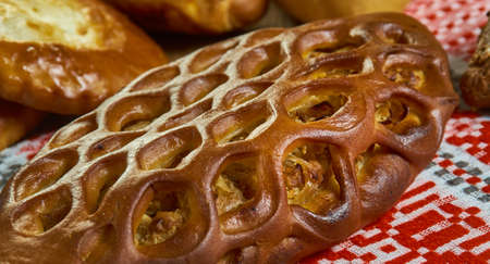 Pirog, Russian traditional pies piroshki , assorted pastry: dishes, Top view.Savoury versions may consist of meat, fish, mushrooms, cabbage, rice, buckwheat groats or potato.の写真素材