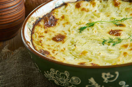 Potatoes Romanoff, baked with sour cream, green onions and processed cheese , Russian 19th century classic cuisine , assorted  dishes, Top view.の写真素材