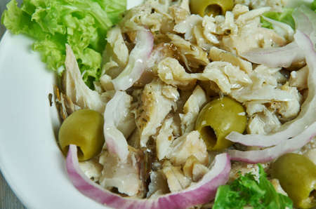 Baccala Salad, Salt cod salad, Italian-American cuisine, Traditional assorted dishes, Top view.