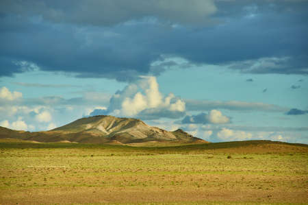 Mongolia. Sands Mongol Els dunes . Herds graze in the spring green valleyの写真素材