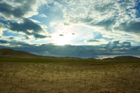 Mongolia. Sands Mongol Els dunes . Herds graze in the spring green valleyの写真素材