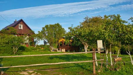 Belarusian Country village house in sunny dayの写真素材