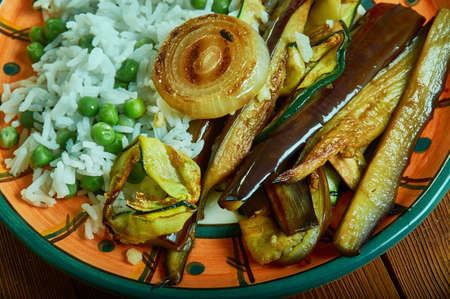 Aubergines in Tamarind Sauce with Baked Halloumi and Saffron Riceの写真素材