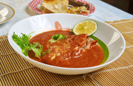 Poached Salmon in Coconut Lime Sauce,  close up Thai coconut curry sauce の写真素材