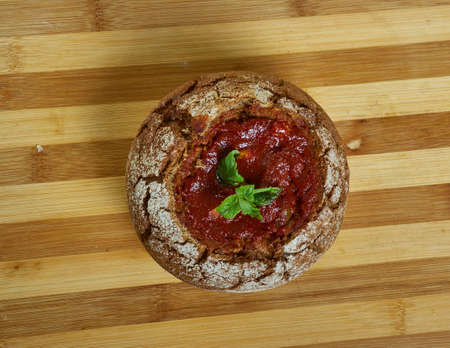 Tomato Soup in  Bread Bowls  , creamy goat cheese tomato soup