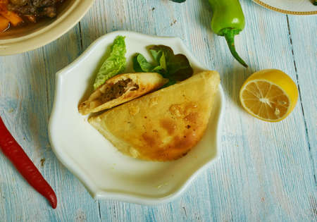 Jamaican beef patties, Caribbean cuisine, Traditional assorted  dishes, Top view.