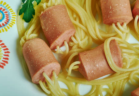 Sausages stuffed with spaghetti. Creative food concept