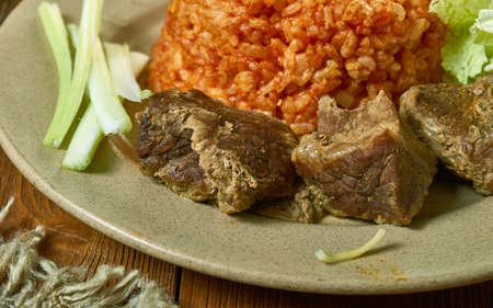 Jollof Rice Beef Kebab , Ghanaian cuisine, Traditional assorted African dishes, Top view.