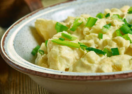 Southern Potato Salad , small bowl, mix together mayonnaise, mustard, vinegar, sugar, and onion powderの写真素材