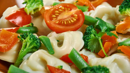 Tortellini Primavera, Italian-American cuisine, his creamy tortellini and vegetable pasta.の写真素材