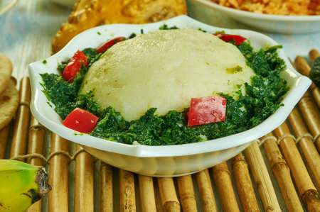 Ugali Sukuma Wiki, made with collard greens, known as sukuma, cooked with onions and spices. Kenyan...