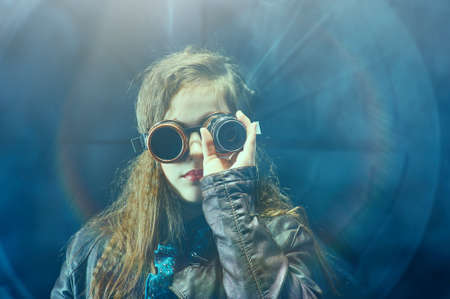 Beautiful steampunk teen girl  over vintage background, model in the style of a steampunk in a...