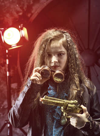 Beautiful steampunk teen girl  a gunl, model in the style of a steampunk in a beautiful creative studio. Fashion, styleの写真素材
