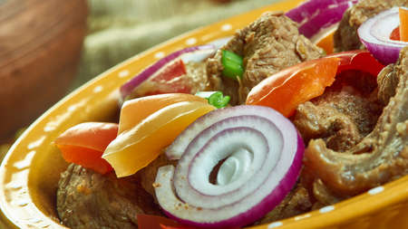 Asun - Spicy Roast Goat, popular Nigerian electable spicy roasted goat chopped into bite-sized...
