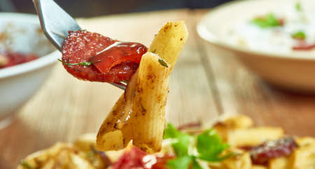 Penne with chorizo , caramelized onions , flavor to this penne dish.の写真素材