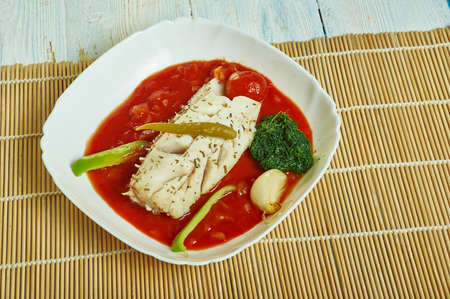 Herb  garlic baked cod with romesco sauce and  spinachの写真素材