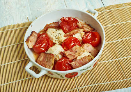 Cod with chopped tomatoes,  crispy pancetta, Tip the sauce into a casserole dish,の写真素材