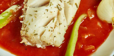 Herb  garlic baked cod with romesco sauce and  spinach