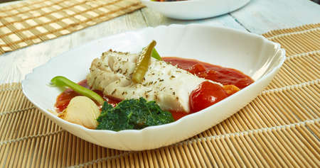 Herb  garlic baked cod with romesco sauce and  spinachの写真素材
