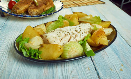 Sizzling cod, Baked fish fillet with potatoes  peppersの写真素材