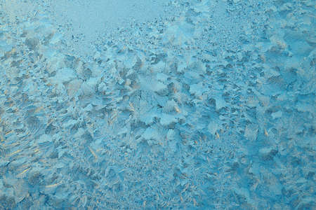 winter icy patterns - Picture of frost on the glass at sunset