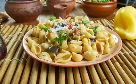 Caponata pasta - Sweet-sour eggplant caponata makes a great sauce for Conchiglie, Sicilian dishes