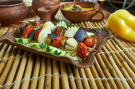 Grilled aubergine tabbouleh, flavorful and filling couscous tabbouleh topped with crispy grilled aubergineの写真素材