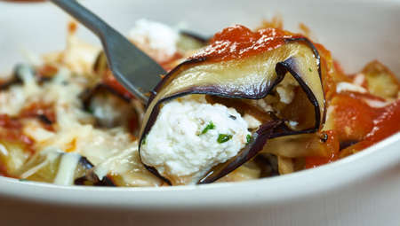 Eggplant Lasagna Rolls, ricotta filling onto each eggplant slice or lasagna noodle and roll up.