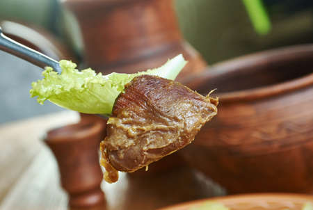 Boodog - Mongolian cuisine dish of barbecued goat or Tarbagan marmot cooked with heated stones...
