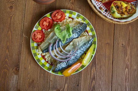 Israeli Fried mackerel fish with Ptitim close up Mediterranean cuisineの写真素材
