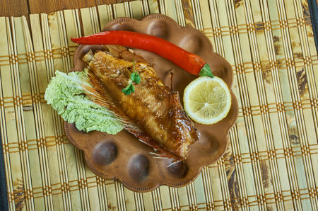 Pwason griye - t popular fish dish on the Seychelles Islands, red snapper or rabbit fish is grilled