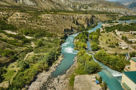 Gunb hydroelectric power station, big mountain formation in the background. Dagestan, Russiaの写真素材