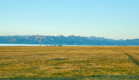 son kul mountain lake in kyrgyzstan is located at an altitude of over 3000 metersの写真素材