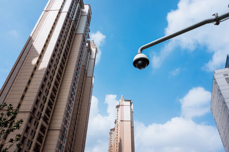 Urban high-rise buildings and surveillance cameras