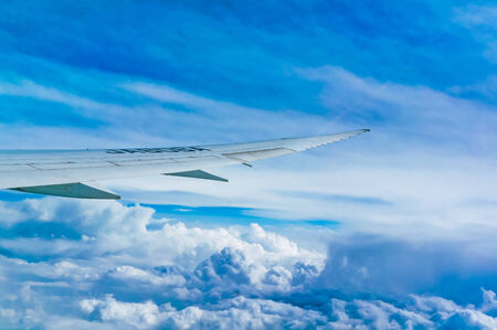 Being flown in an airplane wingのeditorial素材