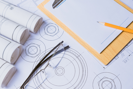 Ruler, eraser, glasses and a pencil on the floor plan の写真素材