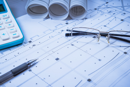 Ruler, eraser, glasses and a pencil on the floor planの写真素材