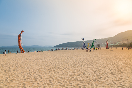 April 15, 2014: at noon on the beach in Dameisha, a group of unidentified people playing, it is not certain. Dameisha is one of the most popular beaches in Shenzhen.のeditorial素材