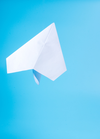A paper plane in the skyの写真素材